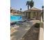 Community pool and lounging area with palm trees at 2232 Aspen Mirror Way # 204, Laughlin, NV 89029