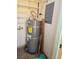 A utility closet featuring a hot water tank and some basic shelving for storage at 2232 Aspen Mirror Way # 204, Laughlin, NV 89029