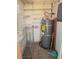 A utility closet with shelving and a water heater, offering storage and essential home systems at 2232 Aspen Mirror Way # 204, Laughlin, NV 89029
