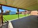 Large backyard featuring artificial grass, a covered patio and a pergola at 3105 Palo Verde Dr, Laughlin, NV 89029