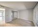 Large bedroom featuring modern laminate flooring, mirrored closet, and patio access at 3411 Sunfish Dr # B, Henderson, NV 89014