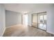 Spacious bedroom with laminate flooring, mirrored closet doors and entry to the enclosed patio at 3411 Sunfish Dr # B, Henderson, NV 89014