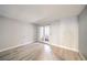 Bright bedroom with laminate flooring and access to an enclosed patio through glass doors at 3411 Sunfish Dr # B, Henderson, NV 89014