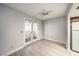 Bedroom with wood-look floors, a ceiling fan, and sliding glass doors to the balcony at 3411 Sunfish Dr # B, Henderson, NV 89014