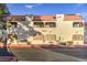 Attractive two-story condo building featuring a red tile roof and desert landscaping at 3411 Sunfish Dr # B, Henderson, NV 89014