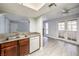 Kitchen showcasing granite countertops and stainless steel sink with a view of the living room and balcony at 3411 Sunfish Dr # B, Henderson, NV 89014