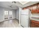 Kitchen area featuring a large white refrigerator and dining area with sliding glass doors to a patio at 3411 Sunfish Dr # B, Henderson, NV 89014