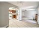 Open living space featuring white appliances and access to a dining area and separate living room at 3411 Sunfish Dr # B, Henderson, NV 89014