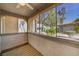 Enclosed patio featuring textured walls and views of mature shade trees and a common area at 3411 Sunfish Dr # B, Henderson, NV 89014