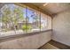 Enclosed patio featuring textured walls and view of a common building at 3411 Sunfish Dr # B, Henderson, NV 89014