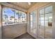 Patio view of adjacent residential building and glass paneled door to inside at 3411 Sunfish Dr # B, Henderson, NV 89014