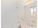 Bathroom features a large mirror and shower-tub combo at 3426 Dry Gulch Dr, Laughlin, NV 89029