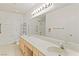Bright bathroom featuring double sink vanity, tile flooring and plenty of counter space at 3426 Dry Gulch Dr, Laughlin, NV 89029