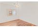Cozy bedroom with hardwood floors, a neutral paint scheme, and natural light at 3426 Dry Gulch Dr, Laughlin, NV 89029