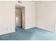 Empty bedroom with blue carpet and neutral walls at 3426 Dry Gulch Dr, Laughlin, NV 89029