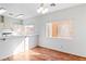 Bright dining area featuring hardwood floors, a white breakfast bar, and natural light at 3426 Dry Gulch Dr, Laughlin, NV 89029