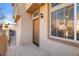 Inviting front entrance with a tiled patio and well-lit doorway at 3426 Dry Gulch Dr, Laughlin, NV 89029