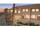 Charming townhouse with a red tile roof, stucco exterior, and well-maintained landscaping at 3426 Dry Gulch Dr, Laughlin, NV 89029