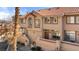 Townhome exterior with landscaped front yard and desert style yard at 3426 Dry Gulch Dr, Laughlin, NV 89029
