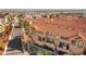 Aerial view of condo complex showing the building exteriors, desert landscaping, and community features at 3426 Dry Gulch Dr, Laughlin, NV 89029