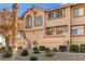 Townhome exterior with landscaped front yard and desert style yard at 3426 Dry Gulch Dr, Laughlin, NV 89029