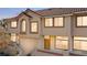 Attractive two-story townhouse with a red tile roof and a neutral stucco exterior at 3426 Dry Gulch Dr, Laughlin, NV 89029