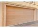 Tan garage door with rectangular pattern at 3426 Dry Gulch Dr, Laughlin, NV 89029