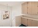 Hallway features built-in cabinets, carpet flooring, and a window at 3426 Dry Gulch Dr, Laughlin, NV 89029