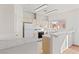 This is a simple kitchen with light countertops, white appliances, and ample natural light at 3426 Dry Gulch Dr, Laughlin, NV 89029