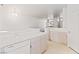 Bright kitchen featuring tiled countertops, stainless steel sink, and built in dishwasher at 3426 Dry Gulch Dr, Laughlin, NV 89029
