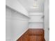 Walk-in closet features hardwood flooring, and shelving for maximum storage at 3637 Pinnate Dr, Las Vegas, NV 89147