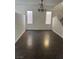 Open dining room featuring tiled floors, neutral walls, and a charming chandelier at 3637 Pinnate Dr, Las Vegas, NV 89147