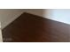 Dark laminate flooring with a white trim at 3637 Pinnate Dr, Las Vegas, NV 89147