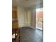 Kitchen area with dark countertops, ample cabinet space, and sliding glass door to the patio at 3637 Pinnate Dr, Las Vegas, NV 89147
