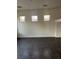 Spacious living room showcasing tile flooring, neutral paint, and an abundance of natural light at 3637 Pinnate Dr, Las Vegas, NV 89147