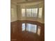 Bright living room featuring hardwood floors and natural light from the bay windows at 3637 Pinnate Dr, Las Vegas, NV 89147