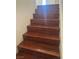 Close up of the wood stairs in the house with white banisters at 3637 Pinnate Dr, Las Vegas, NV 89147
