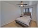 Cozy bedroom with ceiling fan, carpet flooring, and a window for natural light at 3854 E Chaffe Ave, Pahrump, NV 89061