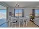 Bright dining area with sliding glass door to backyard patio and a table for six at 3854 E Chaffe Ave, Pahrump, NV 89061
