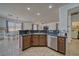 Well-lit kitchen features tile floors, stainless steel dishwasher, and ample countertop space at 3854 E Chaffe Ave, Pahrump, NV 89061