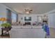 Spacious living room with tile flooring, natural light, comfortable seating and fireplace at 3854 E Chaffe Ave, Pahrump, NV 89061