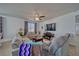 Open living room with tile flooring, comfortable seating, ceiling fan and lots of natural light at 3854 E Chaffe Ave, Pahrump, NV 89061