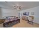 The main bedroom includes carpet floors, a ceiling fan, and neutral colored walls at 3854 E Chaffe Ave, Pahrump, NV 89061