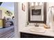 Well-lit bathroom with vanity, updated fixtures, and decorative accents at 3949 S Torrey Pines Dr, Las Vegas, NV 89103