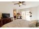 This bedroom includes a TV, full bed, and outdoor views for a relaxing retreat at 3949 S Torrey Pines Dr, Las Vegas, NV 89103