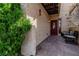Charming entrance with decorative door, textured walls, and outdoor seating area at 3949 S Torrey Pines Dr, Las Vegas, NV 89103