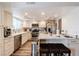Modern kitchen with updated appliances, bright lighting, and countertop seating at 3949 S Torrey Pines Dr, Las Vegas, NV 89103
