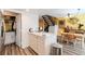 Kitchen island with integrated sink and views of the dining area and staircase at 3949 S Torrey Pines Dr, Las Vegas, NV 89103