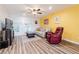 Bright living room with updated flooring, neutral sofa, and natural light at 3949 S Torrey Pines Dr, Las Vegas, NV 89103