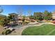 Backyard with a small guest house, running stream, garden and grass at 4680 Suntree Ct, Pahrump, NV 89061